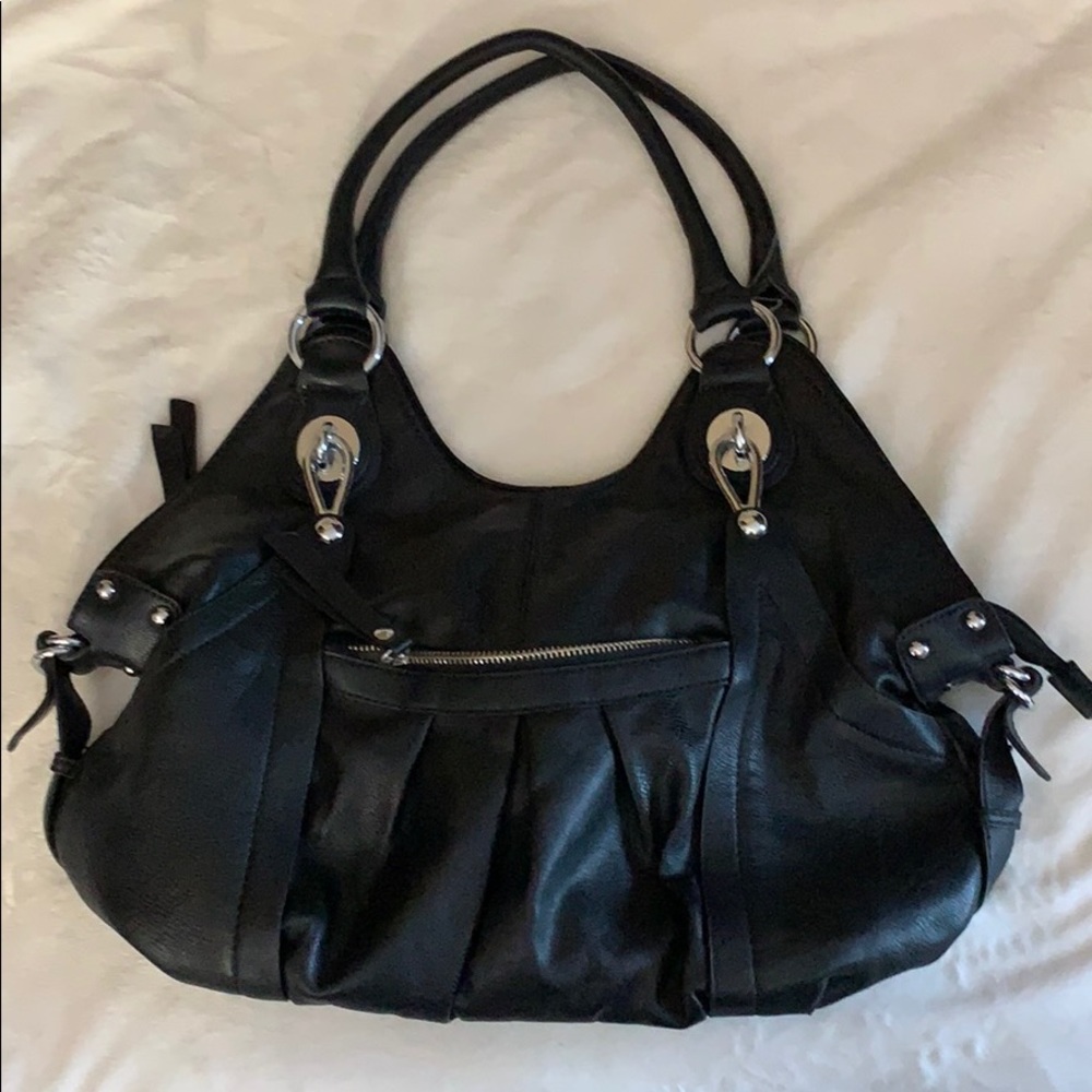 Black purse with tasseled zippers